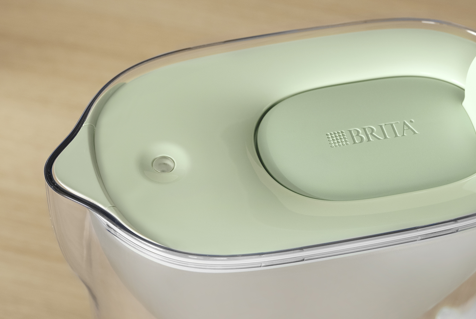 Grüner BRITA Tischwasserfilter Style eco in grün mit Detailsicht des Smart Lights
