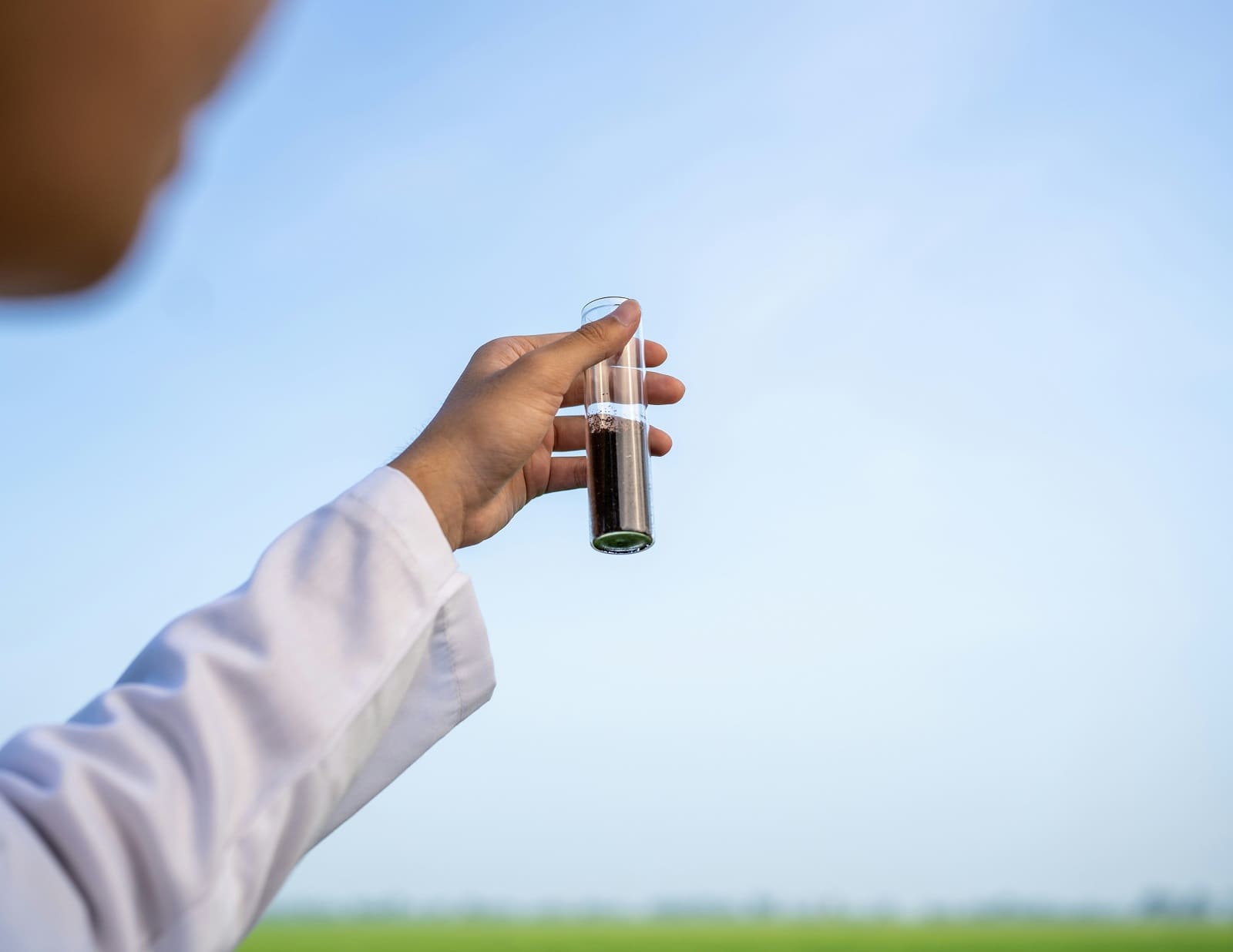 Man holding a test tube Man holding a test tube